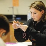 Chelsea Smith works on her iPod during Spencer's chemistry classes. Copyright-Jackson Citizen Patriot