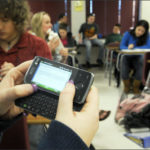 Students in a Project K-Nect math class use smart phones to learn algebra.