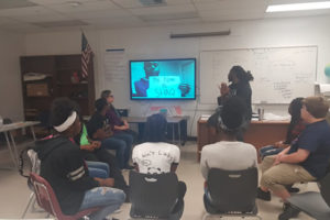 Broward County teacher doing a lesson and showing a video for Black History Month.