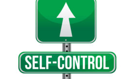 A green road sign with the words self-control on it and an arrow pointing straight