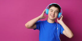 Teenager with headphones listening to music