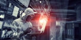 a hacker in a hoodie stealing data