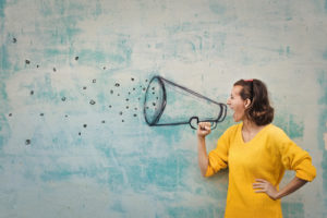 woman shouting into a megaphone
