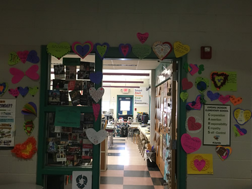 Hearts with student's writing are all over the classroom door