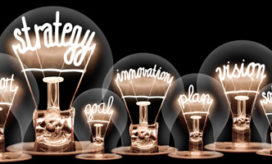 Lightbulbs with different phrases illustrate the components of educational innovation.