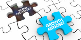 A puzzle piece labeled growth mindset is the perfect size to replace a gap labeled fixed mindset.