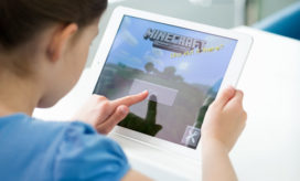 It's easy to start to use Minecraft in the classroom--here, a young student plays Minecraft on an iPad.