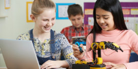 K-12 robotics is finding its place in classrooms--here are some tips to help you incorporate it in your own instruction for students such as these female students working with a robot.