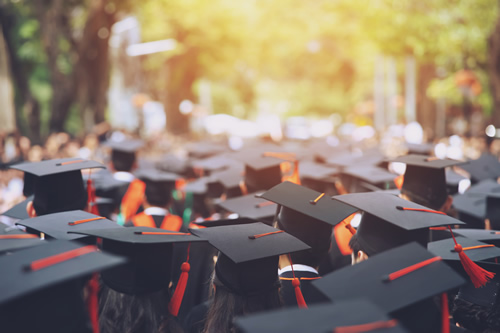 New research is calling for a new definition of what it means to be college-ready, like these graduates walking in graduation caps.
