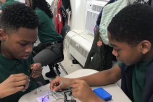 Students are exposed to digital learning opportunities in a school working to close the racial gap in edtech.