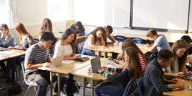 When this district created its Advanced Learning for All program, educators knew the goal was to help students prepare for life after high school, like these high school students using laptops.