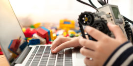 Schools across the globe are making an effort to embed coding and robotics skills and programs into core learning like this Lego Mindstorms boy coding.