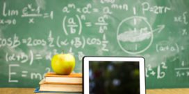 Here are four valuable tips to help your technology-driven campus reach its true potential for students and teachers, like this tablet sitting in front of a chalkboard.