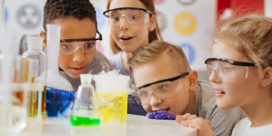 Challenge-Based Learning helps students with their science exploration, like these young students excited about a science experiment in class.