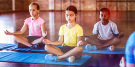 Students are better able to focus when they have time for movement and learning--and these strategies can be used at home while schools are closed, like these kids in yoga class.