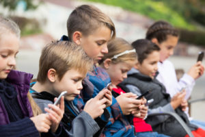 Engaging and relevant exercises delivered via anytime, anywhere edtech tools can help students learn to write effectively and leave so-called social media speak behind, like these students texting.