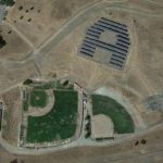 The Athenian School's solar panels form the shape of an 'A' near the school's baseball field.