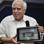 India's Human Resource Development Minister Kapil Sibal displays a low-cost tablet at its launch in New Delhi, India. (AP)